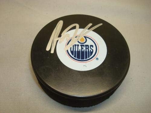 Ryan Nugent-Hopkins potpisao Edmonton Oilers Hockey Puck autogram PSA / DNK COA 1A - AUTOGRAMIRANI NHL Paks